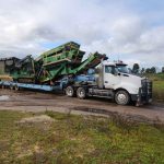 Certified PRR team securing overmass mining machinery for bulk transport